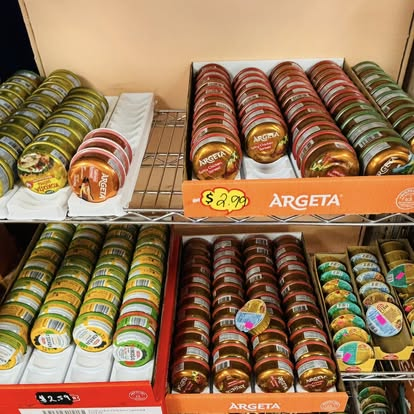 Display of Argeta pâté tins on the market shelf