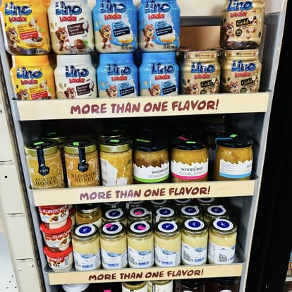 Shelf of Lino Lada hazelnut spreads, acacia honey and assorted preserves